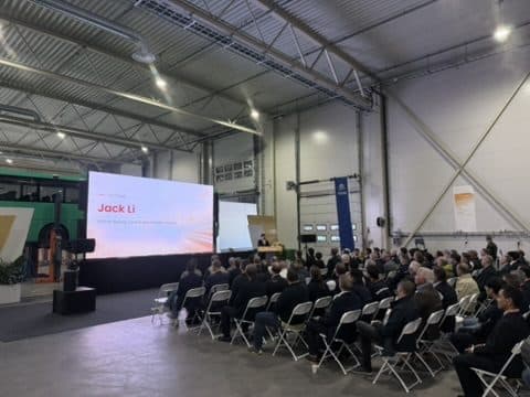 Audience in front of an LED wall during a presentation in a hangar in Stokke, Vestfold